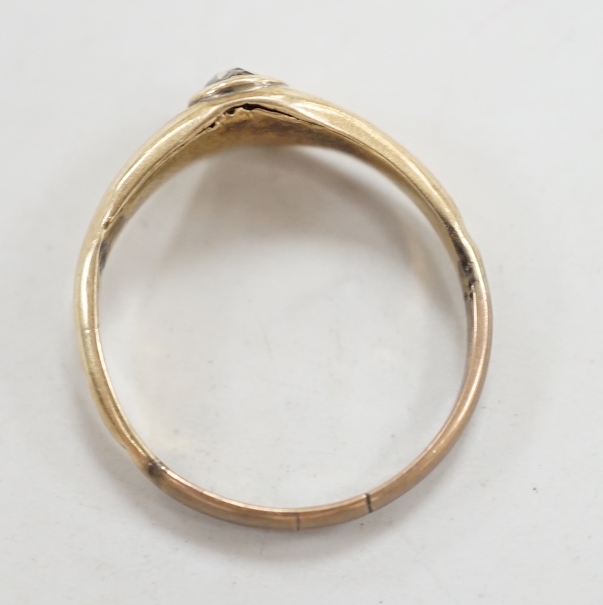 An antique yellow metal and single stone rose cut diamond set ring, size N, gross weight 1.1 grams.